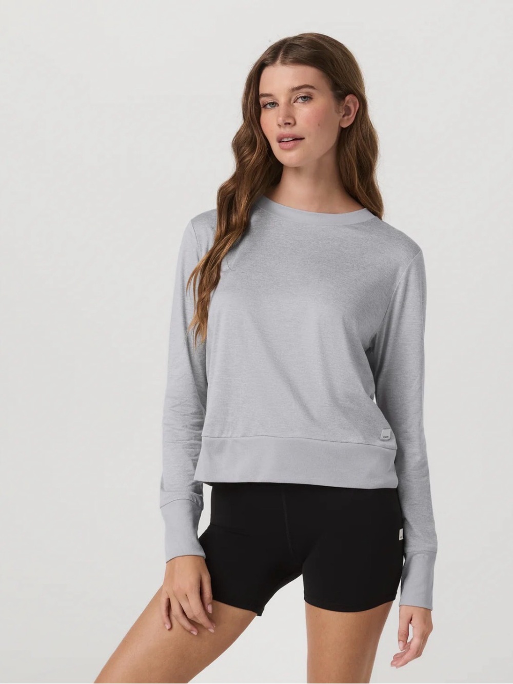 Vuori Women’s Daydream Crew Long-Sleeve Performance Top in Light Heather Grey.